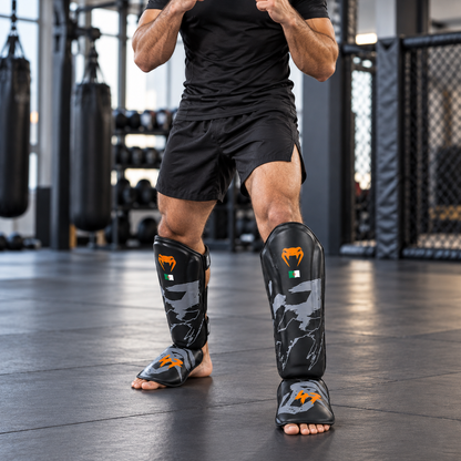 واقي ساق وقدم Venum – أسود × برتقالي بعلم الجزائر | Venum Shin Guards Black & Orange